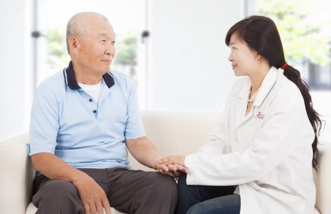 friendly hearing solution doctor caring for senior man