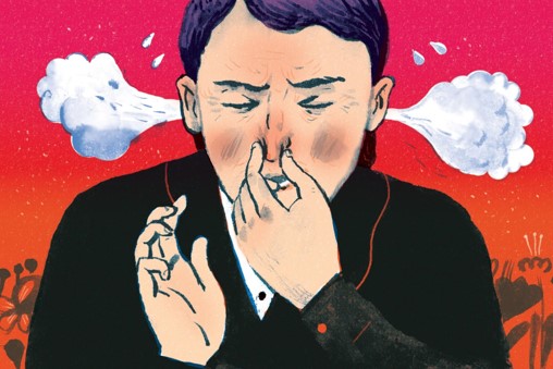 a man pinching his nose when sneezing