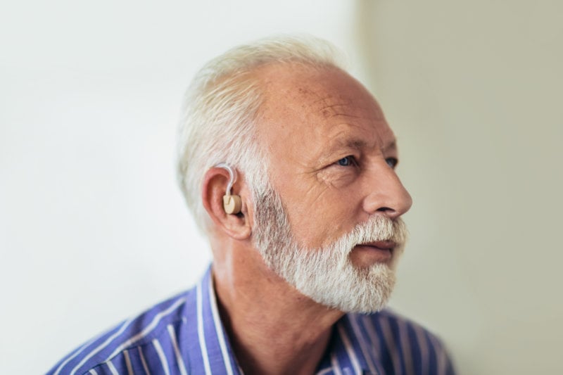 Senior man wearing hearing aid